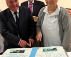 John Keogh and Annie Keegan cut a special cake baked in honour of the opening and dedication of St Saviour’s Parish Hall in Arklow. 