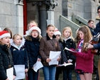 The pupils of Kildare Place School sing carols outside St Ann’s Church, Dawson Street, at the launch of the 2012 Black Santa Sit Out which raises funds for a number of charities including St Vincent de Paul, the Salvation Army, the Simon Community, Protestant Aid, Trust and the Church of Ireland Overseas Aid. The appeal continues until Christmas Eve.