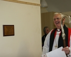 The Archbishop of Dublin and Bishop of Glendalough, the Most Revd Dr John Neill with the plaque he unveiled to mark the official opening of new parish rooms in Calary Parish Church.