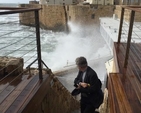 The Revd Ken Rue escapes a wave at Akko during the visit of a delegation from Dublin and Glendalough to the Diocese of Jerusalem. (Photo: Linda Chambers)