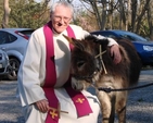 Canon Horace McKinley and Thistle the donkey prepare for Palm Sunday Procession in Whitechurch.