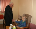 The Archbishop of Dublin, the Most Revd Dr John Neill with a resident of St Mary's home, Pembroke Park during his visit there to bless and dedicate the newly refurbished facilities.
