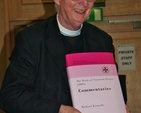 Canon Michael Kennedy pictured with a rare hard copy of his virtual resource, ‘Canon Michael Kennedy's Commentaries on the BCP 2004’, at its launch at the Church of Ireland General Synod in Armagh.