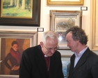 The Archbishop of Dublin lends an ear to artist, Mick O’Dea RHA at the opening of the Hermione Art Exhibition in Alexandra College.
