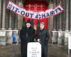 Dublin's 'Black Santas' the Revd Canon Tom Haskins [retired] Vicar of St Ann's and his former Curate, the Revd Joyce Rankin during their sit out for charity (9am - 6pm daily) until Christmas Eve (starts later on Sunday).