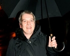 Uta Raab of the Dublin Council of Churches shelters from the rain on the Ecumenical Walk of Light which took place on Sunday November 25. 