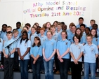 Third to sixth classes at Athy Model School perform at the official opening of their new school building. 