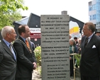 Jim Martin, Principal of Marino College of Further Education; Cllr Ray McAdam, representing the Lord Mayor of Dublin; and German Ambassador Busso Von Alvensleben viewing the North Strand Bombing commemorative plaque in the Memorial Garden at Marino College of Further Education. 