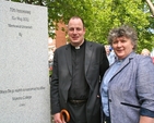 The Revd Roy Byrne, Rector of Drumcondra and North Strand parish, and the Revd Aisling Shine, Curate-Assistant in the parish, beside the North Strand Bombing commemorative plaque in the Memorial Garden at Marino College of Further Education. 