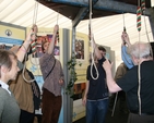 Ringing the bells at the churches' joint stall.