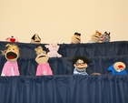 Participants showing what they learnt at the 'Using puppets for the first time' seminar at the Building Blocks Conference, All Hallows College.
