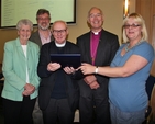Canon Michael Kennedy pictured with members of his family and Archbishop Alan Harper at the launch of his virtual resource, ‘Canon Michael Kennedy's Commentaries on the BCP 2004’, at the Church of Ireland General Synod in Armagh.