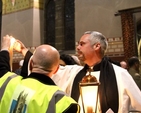 The Revd Andrew McCroskery lighting a candle in St Bartholomew’s Church, Clyde Road, during the 2014 Dublin Council of Churches Walk of Light. 