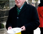 Arthur Vincent shakes a bucket outside St Ann’s Church, Dawson Street, at the launch of the 2012 Black Santa Sit Out. 