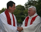 The former Rector of Greystones, the Venerable Edgar Swann (right) congratulates his successor, the Revd David Mungavin at the latter's institution.