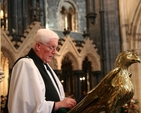 Newly installed Cathedral Canon, the Revd Canon Robert Deane reads the Gospel in Christ Church Cathedral.