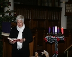 The Revd Canon Katharine Poulton reads a lesson at the Community Carols service in St Georges and St Thomas. 