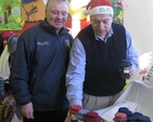 Colin Boyle and Gareth Hickey discuss the qualities of some jam at the recent Sandford Parish Christmas Bazaar.
