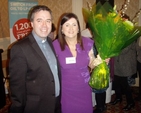Rector of Narraghmore and Timolin with Castledermot and Kinneagh, the Revd Isaac Delamere presents flowers to the coordinator of the Neven Maguire Cookery Evening, Fiona Hawkins.