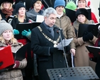 The Lord Mayor, Andrew Montague, reads a lesson at the community carol singing outside the Mansion House. 
