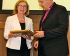 Archbishop Michael Jackson making a presentation to Minister Jan O’Sullivan at the Faith and Partnership Conference. 