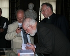 The Revd Dr Billy Marshall signing copies of his book 'Scripture, Tradition and Reason' at its launch in Trinity College Dublin.