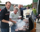 Tending the BBQ. Robin Moody and Heather Moody producing the Haute Cuisine at the annual Donard and Dunlavin Parish Ride out and BBQ in Moat Farm, Donard.