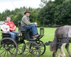Trying out a more stately form of transport at a County Wicklow parish Fete and Raceday. 