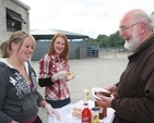 Donna Moody and Jill Hanbridge provide the grub for the Rector, the Revd Declan Smith at the Donard and Dunlavin Parish Ride out and BBQ in Moat Farm, Donard.