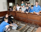 Pupils from Blessington No 1 School burying their time capsule under the new floor of St Mary’s Church. The box is filled with items and information to show the people of the future how we live today. 