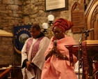 Ms Rom Olusa leads the prayers at the Discovery Advent Service in St Maelruain's Church, Tallaght. Also pictured in the background is the Diocesan Chaplain to the International Community, the Revd Obinna Ulogwara.