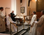The Registrar, the Revd Canon Victor Stacey (3rd left) reads the Act of Institution at the Institution of the Revd Canon Mark Gardner (2nd right) as Vicar of the St Patrick's Cathedral Group of Parishes in St Catherine's Church, Donore Avenue. Also pictured (left to right) are the Archbishop's Chaplain, the Revd David MacDonnell, the Archbishop of Dublin, the Most Revd Dr John Neill and the Archdeacon of Dublin, the Venerable David Pierpoint.