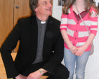 Rev Gary Dowd with a seven year old St Paul’s parishioner who gave all her pocket money to Kisiizi project which raised €200,000 for the construction of a new theatre building at the Ugandan Hospital and the training of an additional surgeon.