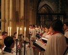 The Christ Church Cathedral Choir accompanied by acolytes singing at the Advent Sunday candlelit service in Christ Church Cathedral.