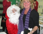 Santa hears Linda Evan’s Christmas List at the recent Sandford Parish Christmas Bazaar.