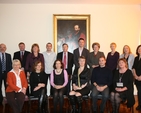 Staff of the Church of Ireland College of Education, including principal Anne Lodge, pictured before a portrait of The Revd H Kingsmill Moore who was principal of the college from 1884-1927.