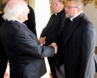 The Revd David Oxley is greeted by President Michael D Higgins at Áras an Uachtaráin during the visit of Cumann Gaelach na hEaglaise. 