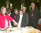Pictured are four newly confirmed young people from Dublin about to cut the celebratory cake at their confirmations. They are pictured with the Revd Canon Katharine Poulton and the Archbishop of Dublin, the Most Revd Dr John Neill.