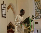 Ife Ademowo, son of the Archbishop of Lagos, the Most Revd Adebola Ademowo reads the lesson in Whitechurch at the baptism of his son, John.
