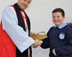 Archbishop Michael Jackson was presented with a memento of his visit to St Andrew’s National School, Malahide, for the opening of the school’s new extension. 
