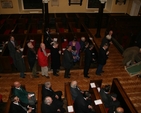 The congregation pay their respects to the fallen at the Armistice Day Service, St Ann's Church, Dawson St.