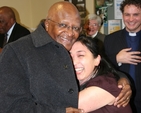 The former Archbishop of Cape Town, the Rt Revd Desmond Tutu with a friend during his visit to Trinity College, Dublin.