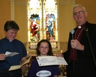 Pictured is the Archbishop of Dublin, the Most Revd Dr John Neill receiving a cheque on behalf of Sightsavers International for EUR 10,000, the Proceeds of the Sunday School Society's Lenten Campaign. The presentation took place at a special concert in Rathfarnham to mark 200 years of the society's existence. 
