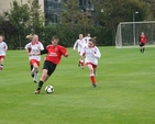 Pictured is action from a Soccer match between Alexandra College  under 14s (red and white) and Cherry Orchard Boys u12s (black and red). The match was part of a programme of events to mark the official opening of two new pitches and one all purpose court in Alexandra College. Cherry Orchard won the match 4-2.