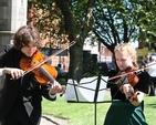 Members of the Langley Youth Orchestra in an impromptu outdoor rehearsal in Christ Church Cathedral before their Concert inside. 