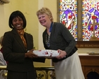 Ann Walsh, Diocesan President of the Mothers' Union receiving a gift from Tina Mutwarasibo after preaching at the Discovery Mothering Sunday Service in St John's Clondalkin.