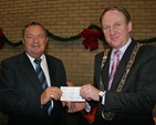 Arthur Vincent, Treasurer at St Ann's, presenting the Lord Mayor of Dublin, Gerry Breen, with a cheque for €900. The money was raised for the Lord Mayor's Charities by a collection during the Civic Carol Service in St Ann's Church, Dawson Street. 