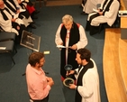 The Revd Craig Cooney (right) receives a chalice and paten from Greg Jones at his introduction as Minister in Charge of CORE.