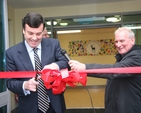 Minister Brian Lenihan cuts the ribbon at the official opening of Castleknock National School's new extension.