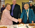 Rosemary Knight, Archbishop Michael Jackson and Catherine McGuinness cut the cake marking the 150th anniversary of Kill O’ the Grange parish church. 